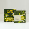 Bush Berry Sip & Go Matcha packaging, featuring a dark green box and a matching flat pouch with white flowers and yellow text, set against a plain light gray background.