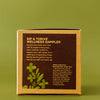 Box labeled 'Sip & Thrive Wellness Sampler' on a green background