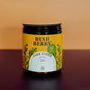 Jar of Bush Berry Fire Cider on a gradient background