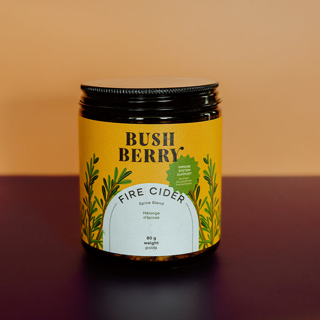 Jar of Bush Berry Fire Cider on a gradient background